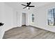 Bright bedroom featuring luxury vinyl floors, ceiling fan and closet at 4210 Day St, Port Charlotte, FL 33948