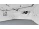 Clean, empty garage with an epoxy floor, and overhead door opener ready for cars or storage at 4210 Day St, Port Charlotte, FL 33948