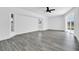 Open living area with neutral colors, hardwood flooring, and access to the outdoor lanai at 4210 Day St, Port Charlotte, FL 33948