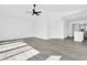 Open concept living room with hardwood floors and neutral paint, adjacent to the kitchen at 4210 Day St, Port Charlotte, FL 33948