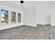 Bright room with new flooring, pendant lighting, and arched doorway, offering a modern and inviting atmosphere at 4210 Day St, Port Charlotte, FL 33948