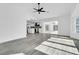 Open floor plan with living room, kitchen, and lanai views, filled with natural light at 4210 Day St, Port Charlotte, FL 33948