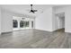 A spacious living area boasts sleek flooring, expansive sliding doors to the pool, and modern finishes at 4210 Day St, Port Charlotte, FL 33948