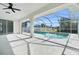 Screened lanai overlooking an in-ground pool with a beautiful view at 4210 Day St, Port Charlotte, FL 33948