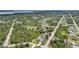 Aerial shot of house nestled in a quiet neighborhood of homes surrounded by natural beauty and waterways at 4510 Burns Ter, Port Charlotte, FL 33981