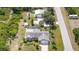A nice aerial view of a single-Gathering home featuring a spacious yard, pool and two storage buildings at 4510 Burns Ter, Port Charlotte, FL 33981