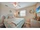 Inviting bedroom features wood-look tile flooring and a ceiling fan at 4510 Burns Ter, Port Charlotte, FL 33981