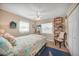 Serene bedroom with coastal decor and soft lighting, featuring built-in shelving at 4510 Burns Ter, Port Charlotte, FL 33981