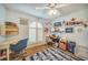 Bright bedroom with a large arched window, wood-look tile, and a fun, nautical theme at 4510 Burns Ter, Port Charlotte, FL 33981
