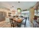 Bright and spacious kitchen area featuring granite countertops, stainless steel appliances, and an adjacent dining space at 4510 Burns Ter, Port Charlotte, FL 33981