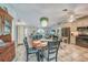 Open concept dining and living area featuring a stylish light fixture and seamless flow for modern living at 4510 Burns Ter, Port Charlotte, FL 33981