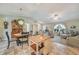 Open concept living and dining area with access to the kitchen and the adjacent living room with cozy furnishings at 4510 Burns Ter, Port Charlotte, FL 33981