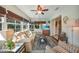 Cozy living room with neutral furniture, large windows, and seamless transition to the outdoors at 4510 Burns Ter, Port Charlotte, FL 33981