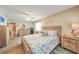 Spacious bedroom featuring wood-look tile flooring, and coastal decor at 4510 Burns Ter, Port Charlotte, FL 33981