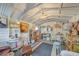 Charming shed or hobby room featuring bright walls, eclectic decorations, and shelving with comfortable seating at 4510 Burns Ter, Port Charlotte, FL 33981