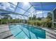 Beautiful pool with an extended lanai offering ample space for outdoor leisure and gatherings at 4510 Burns Ter, Port Charlotte, FL 33981
