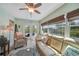 Inviting sunroom with comfortable seating, natural light, and views of the outdoor area at 4510 Burns Ter, Port Charlotte, FL 33981