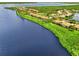 Community aerial view of homes lining a picturesque waterfront, blending residential comfort with natural beauty at 4612 Club Dr # D102, Port Charlotte, FL 33953