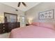 Bedroom featuring a mirror, dresser, and queen bed at 4612 Club Dr # D102, Port Charlotte, FL 33953