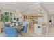 Dining area with bead chandelier and view to kitchen, offering a warm and inviting space at 4612 Club Dr # D102, Port Charlotte, FL 33953