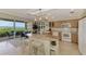 Bright kitchen with modern appliances and counter seating, providing a convenient gathering spot at 4612 Club Dr # D102, Port Charlotte, FL 33953