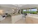 Open-concept living space with a kitchen island, dining area, and views of the water at 4612 Club Dr # D102, Port Charlotte, FL 33953