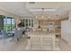 Kitchen open to dining, featuring counter seating, providing a practical layout for entertaining at 4612 Club Dr # D102, Port Charlotte, FL 33953