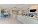 Open floor plan featuring a spacious living area adjacent to a dining area and kitchen at 4612 Club Dr # D102, Port Charlotte, FL 33953