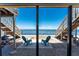 Beautiful backyard featuring serene water views, dual staircases, and two chairs at 5041 N Beach Rd # 2A And 2B, Englewood, FL 34223