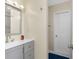 Bathroom with a vanity and a door at 5041 N Beach Rd # 2A And 2B, Englewood, FL 34223