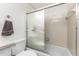 Bright bathroom features a shower/tub combo at 5041 N Beach Rd # 2A And 2B, Englewood, FL 34223