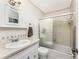 Bright bathroom features a shower/tub combo and a vanity with ample storage space at 5041 N Beach Rd # 2A And 2B, Englewood, FL 34223