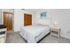 Cozy bedroom featuring a ceiling fan, closet, and serene ambiance at 5041 N Beach Rd # 2A And 2B, Englewood, FL 34223