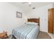 Bedroom with natural light, ceiling fan, and striped bedspread at 5041 N Beach Rd # 2A And 2B, Englewood, FL 34223