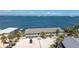 Exterior of two-story apartment building with parking and palm trees overlooking ocean at 5041 N Beach Rd # 2A And 2B, Englewood, FL 34223