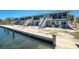 Waterfront property featuring a dock and outdoor living spaces at 5041 N Beach Rd # 2A And 2B, Englewood, FL 34223