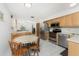 Bright kitchen with stainless steel appliances and adjacent dining area at 5041 N Beach Rd # 2A And 2B, Englewood, FL 34223