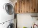 Laundry room featuring washer, dryer and storage cabinets at 5041 N Beach Rd # 2A And 2B, Englewood, FL 34223