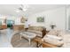 Bright living room showcasing a kitchen bar with barstools for casual dining at 5041 N Beach Rd # 2A And 2B, Englewood, FL 34223