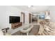 Open floor plan with a living room leading into a kitchen with stainless steel appliances at 5041 N Beach Rd # 2A And 2B, Englewood, FL 34223