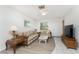Inviting living room with a decorative glass coffee table and comfortable seating at 5041 N Beach Rd # 2A And 2B, Englewood, FL 34223