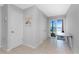 This hallway showcases access to the patio, with views of the water through sliding glass doors at 5041 N Beach Rd # 2A And 2B, Englewood, FL 34223