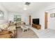 Cozy living room featuring tile and wood flooring, complemented by neutral furnishings at 5041 N Beach Rd # 2A And 2B, Englewood, FL 34223