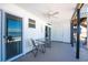 Outdoor patio with seating, ceiling fan, door and slider with a water view at 5041 N Beach Rd # 2A And 2B, Englewood, FL 34223