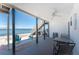 Relaxing outdoor patio offering serene water views, seating, and a barbecue grill at 5041 N Beach Rd # 2A And 2B, Englewood, FL 34223