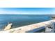 Stunning water view from a deck with stairs and a private dock, perfect for relaxation at 5041 N Beach Rd # 2A And 2B, Englewood, FL 34223