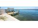 Scenic waterfront view featuring a private dock with a gazebo at 5041 N Beach Rd # 2A And 2B, Englewood, FL 34223
