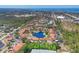 Aerial view of the community with lush landscaping around the central lake at 507 Pine Hollow Cir # 507, Englewood, FL 34223