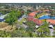 Birds eye view of community with lush landscaping and serene pond at 507 Pine Hollow Cir # 507, Englewood, FL 34223
