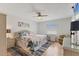 Serene bedroom with light wooden floors, wicker furniture, and a ceiling fan at 507 Pine Hollow Cir # 507, Englewood, FL 34223